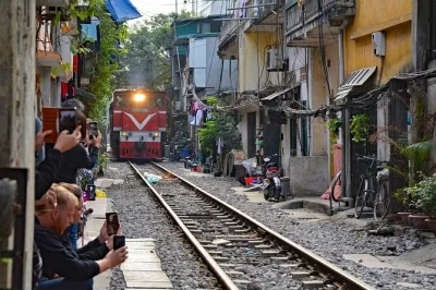 Sample hanoi’s street food with a local guide, then sip coffee on train street as the trains pass by. includes pickup, tastings, and a drink with locals.