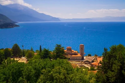 Travel from skopje to tirana with a private transfer and half-day guided tour of ohrid. includes hotel pickup, drop-off, and local guide for a relaxed journey.