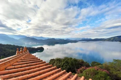 Experience sun moon lake from taichung with a private guide, hotel pickup, and flexible stops. includes bike ride, ferry, cable car, and local insights.