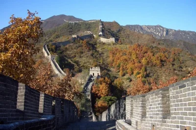 Walk the mutianyu great wall near beijing with a local guide, hotel pickup, and round-trip cable car or toboggan. includes water and private transport.