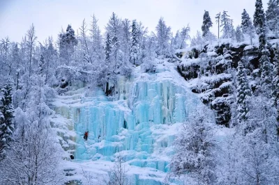 Hike through korouoma canyon’s frozen waterfalls near rovaniemi with a small group and local guide. includes winter gear, hotel pickup, and a finnish campfire snack.