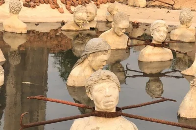 Discover ghana’s nkyinkyim museum & african ancestral wall with a local guide. includes private transport, entry fees, and bottled water for a seamless visit.