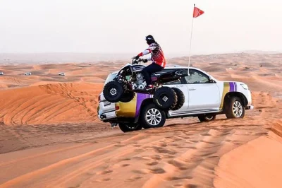 Experience dubai’s desert with dune bashing, camel rides, sandboarding, and a bbq dinner at a bedouin-style camp. includes hotel pickup and local guide.