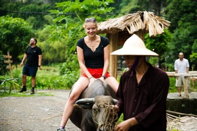 Experience ninh binh’s countryside with rice planting, buffalo riding, and fishing alongside local farmers. includes cooking class, all tools, and bottled water.