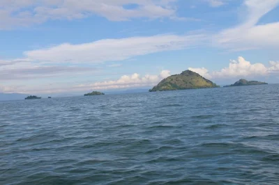 Experience a lake kivu boat trip from karongi or rubavu, explore islands, meet locals, and enjoy snacks on board. includes life jackets, wifi, and local guide.