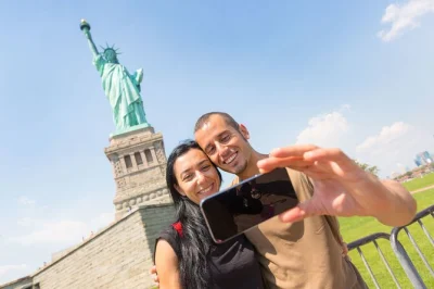 Explore new york’s statue of liberty, ellis island, and the 9/11 memorial with a spanish-speaking guide. includes ferry tickets, museum entry, and local insights.