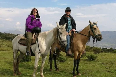 Explore cusco on horseback with a local guide, visit the temple of the moon, enjoy mountain views, and relax with snacks. includes hotel pickup and gear.