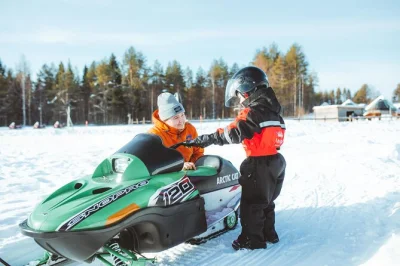 Feel lapland’s wild winter with family snowmobiling near rovaniemi, kids’ mini-snowmobiles, hot berry juice, and transfers to apukka resort. includes warm gear.