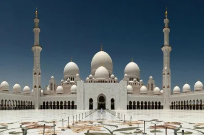 Experience abu dhabi’s grand mosque, emirates palace, corniche, and ferrari world on a full-day tour from dubai with local guide, lunch, and hotel pickup.