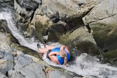 Experience el yunque national park with a certified local guide—natural waterslides, cliff jumps, rope swings, and a lunch stop. includes pickup and entrance fees.