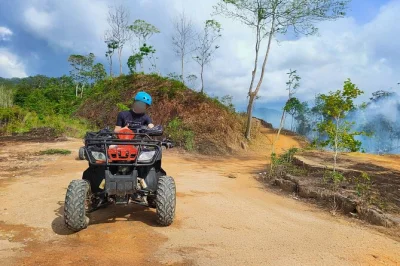 Experience a guided atv ride near khao lak, taste fresh local fruit, and swim at lampi waterfall. includes hotel pickup, refreshments, and a friendly local guide.