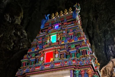 Step into vibrant kuala lumpur with sari dressing at batu caves, a hands-on batik painting workshop, and local indian sweets—includes pickup and guide.