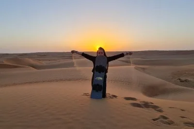 Experience wahiba sands from muscat with camel ride, quad biking, sand boarding, and a visit to a bedouin house. includes hotel pickup and local omani guide.