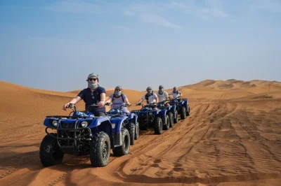 Ride a 350cc yamaha quad bike in dubai’s desert, try sandboarding, enjoy a camel safari, and relax with cold drinks. includes hotel pickup by 4x4.