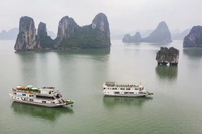 Experience halong bay and lan ha on a 3-day cruise with kayaking, caves, a sunset party, and vietnamese cooking class. includes pickup from hanoi old quarter.