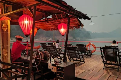 Unwind on a solar-powered mekong river sunset cruise from luang prabang, sip a complimentary cocktail, and enjoy tranquil views with friends or loved ones. includes drink onboard.