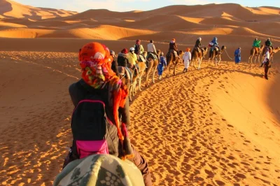 Travel from marrakech to merzouga with a private 3-day tour, atlas mountains drive, camel ride at sunset, and night in a sahara camp. includes pickup and all stays.