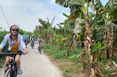 Pedal through hanoi’s lively alleys and banana island, sample street food, and share stories with a local guide. includes hotel pickup, snacks, and coffee.