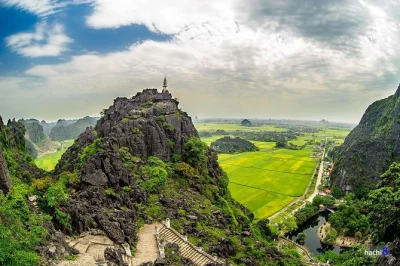 Wake up to rice fields in ninh binh, climb mua cave, row through tam coc, cycle past limestone peaks, and share a meal with a local family. includes pickup.