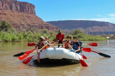 Float past fisher towers and castleton tower on a full day colorado river rafting trip from moab, with local guides, shuttle service, and lunch on a riverside beach.