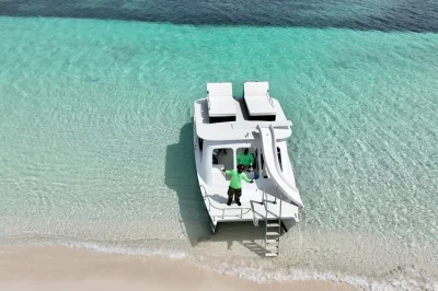 Feel the salt breeze on a private catamaran in grace bay, turks & caicos. snorkel, fish, or just lounge with drinks and lunch included. pickup from your hotel.