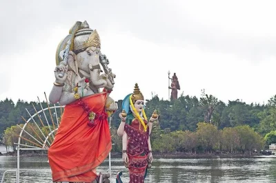 Feel the volcanic breeze at trou aux cerfs, watch chamarel waterfall thunder, and taste mauritian rum. includes pickup, lunch, and all entry fees for a seamless day.