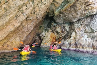 Jump in a kayak on costa brava, snorkel sea caves, and share paella by the beach in tossa de mar. includes small-group van transport from barcelona.