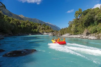 Feel the rush of a waiatoto river jetboat safari in new zealand’s south westland, with local guides, rainforest walk, and snacks included. book for all ages.