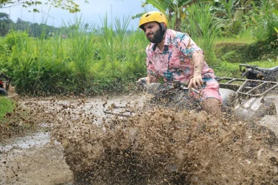 Ride an atv through bali’s jungle, rice fields, and tunnels. guided quad bike tour with lunch, private transport, showers, and all gear included.
