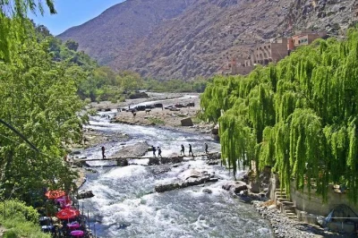 Feel the cool river air, wander berber villages, and share tea in a local home on this ourika valley & atlas mountains day trip from marrakech. includes pickup.