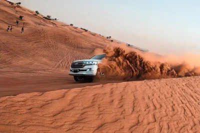 Feel the hum of quad bikes, try sandboarding, and ride camels in dubai’s lahbab desert. includes hotel pickup, bbq dinner, and live camp entertainment.