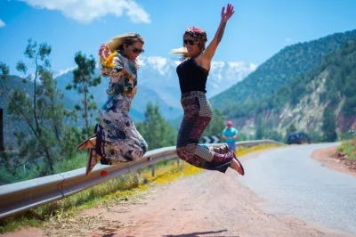 Book a marrakech day trip to the atlas mountains and agafay desert. includes camel ride, berber lunch, village walks, and local tea with a berber family.