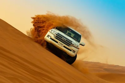 Feel the dubai desert’s red dunes on a private safari with dune bashing, sandboarding, camel rides, live shows & bbq dinner. includes hotel pickup & guide.