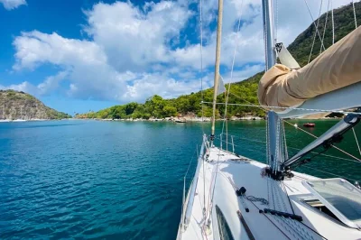 Set sail from gourbeyre to les saintes for a day of sailing, snorkeling at pain de sucre and a shipwreck, creole lunch onboard, and a friendly local skipper.