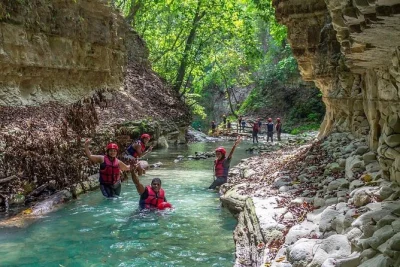 Feel the rush at damajagua falls near puerto plata, hiking and sliding down 7 waterfalls with a local guide. includes pickup, safety gear, and a dominican buffet lunch.