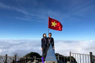 Chase the clouds on a tough fansipan trek from sapa, crossing bamboo forests and streams with a local guide. includes transport, lunch, entry fee, and medal.