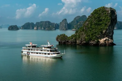 Bai tu long bay cruise with kayaking, thien canh son cave, all meals, and hanoi pickup. escape the crowds for quiet waters, local flavors, and sunset on deck.