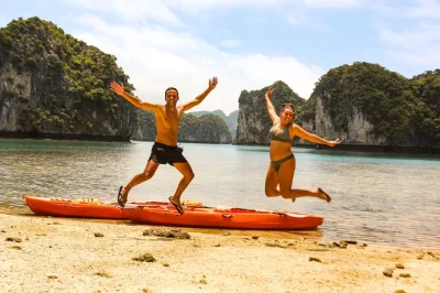 Float through lan ha and ha long bay by kayak and boat, explore cai beo fishing village, swim at ba trai dao beach, and enjoy a vietnamese lunch. small group tour with local guide.