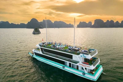 Feel the breeze on halong bay with a luxury day cruise—explore sung sot cave, kayak under limestone cliffs, enjoy a seafood buffet, and relax with hotel pickup.