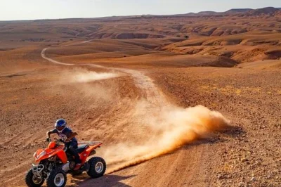 Feel the rush of quad biking in agafay desert, share a moroccan lunch by the pool, and unwind with pickup from marrakech. includes camel ride and local guide.