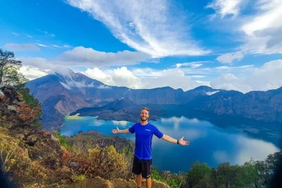Wake up to sunrise over mount rinjani’s crater rim, trek through lombok’s rainforest, share meals with your guide, and camp with sunset views. includes hotel pickup.