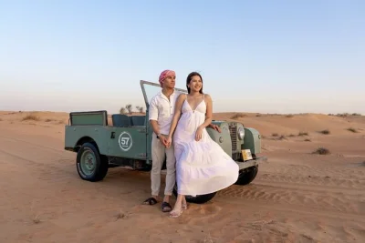 Feel the dubai desert in a vintage land rover, spot arabian wildlife, watch falconry, ride camels, and unwind at a heritage camp with dinner. includes pickup.