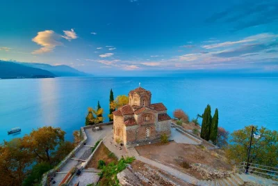 Wake up in tirana, cross into north macedonia for a day trip to ohrid & struga. walk lakeside streets, visit unesco churches, and enjoy hotel pickup included.