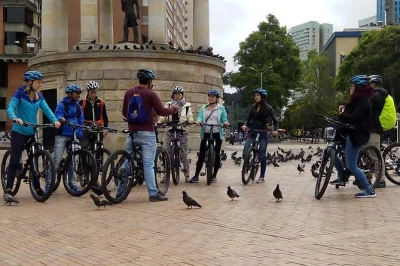 Feel the pulse of bogota on a guided bike tour through the historical center, paloquemao fruit market, and vibrant graffiti streets. includes bike, helmet, and local guide.