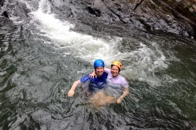 Feel the rush on el yunque’s natural waterslides, swim in luquillo river, and relax at luquillo beach—includes pickup from san juan and local guide.