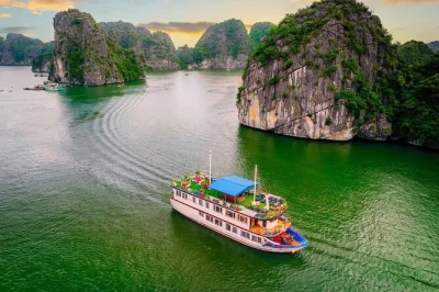 Wake up to limestone cliffs in lan ha bay, kayak quiet waters, swim at ba trái Đào beach, and bike through viet hai village. overnight cruise with meals included.