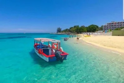 Spend a relaxing day on negril’s famous seven mile beach, try water sports, and catch the sunset at rick’s café. includes hotel pickup and air-conditioned transport.