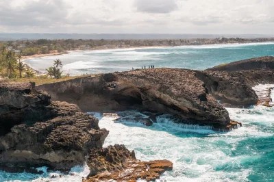 Feel the cool cave air, see ancient petroglyphs, and swim at northern puerto rico waterfalls on this full-day adventure from san juan with pickup and local guide.