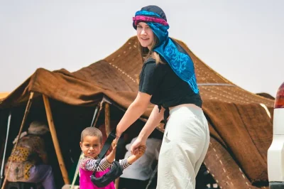 Feel the quiet magic of agafay desert at sunset with a camel ride, mint tea, berber music, and dinner under the stars. includes pickup from marrakech.