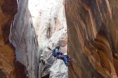 Feel the rush of rappelling into medieval chamber slot canyon near moab, with a licensed guide, all gear, and transport included. hike under morning glory bridge.